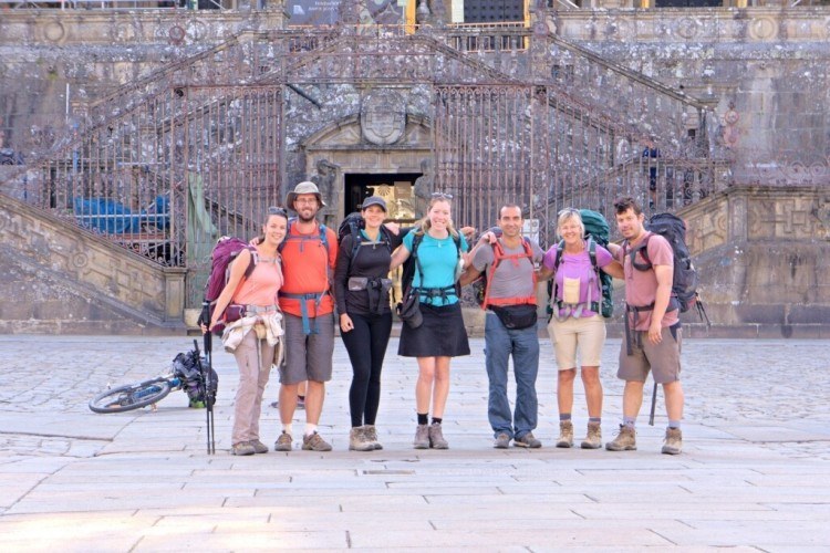 Seven pilgrims in front of Santiago cathedral