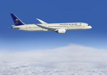 787-9; Saudia; 1st Delivery; air to air; left side of plane; above clouds; K66503