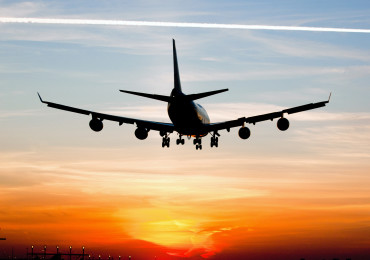 Plane landing by sunrise